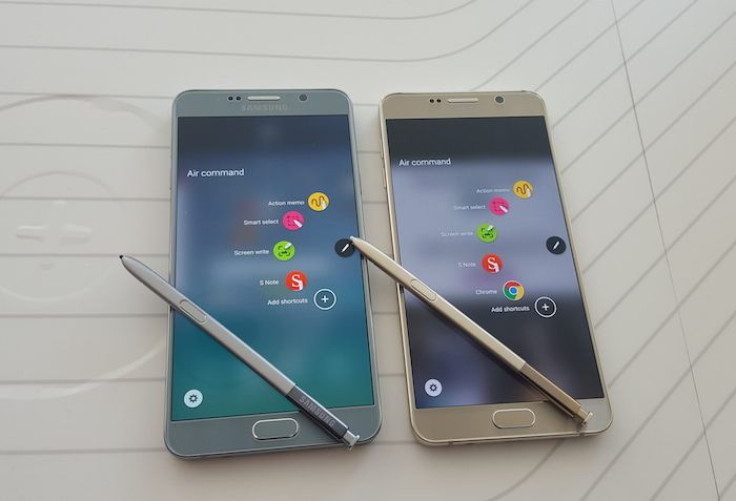Two Samsung Galaxy Note 5 handsets with S-Pens ejected.