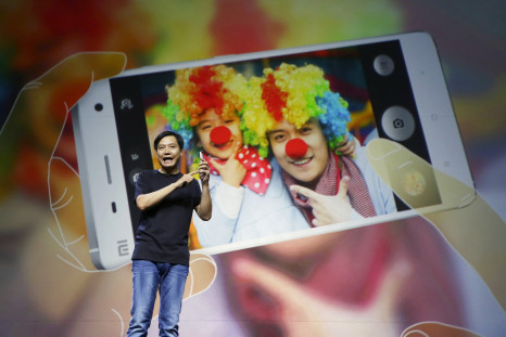 Lei Jun, founder and chief executive officer of China's mobile company Xiaomi, demonstrates the new features of the new Xiaomi Phone 4 at its launching ceremony, in Beijing July 22, 2014. 