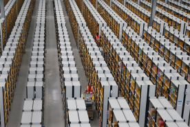 Workers collect orders at Amazon's fulfillment center in Rugeley, central England December 11, 2012. 