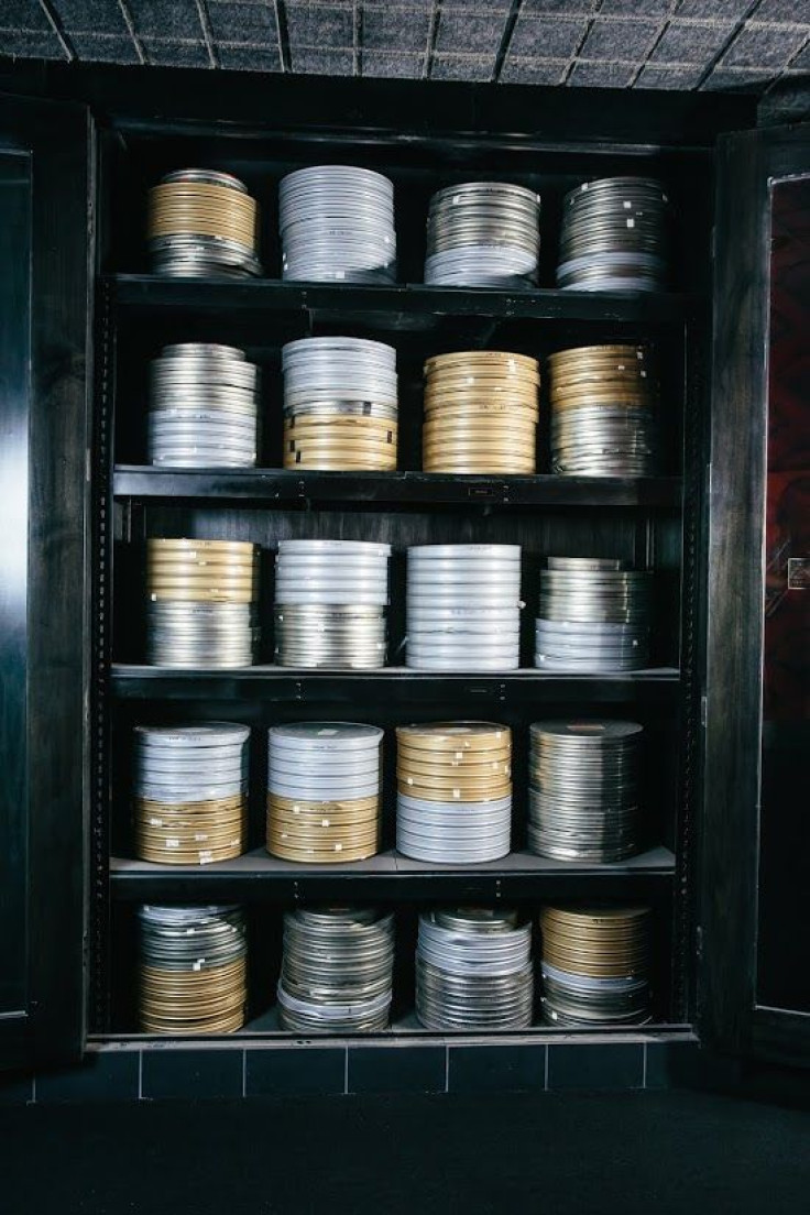 A display case loaded with film canisters at an AGFA location.