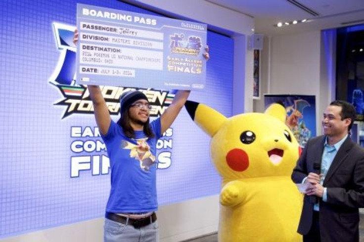  JC Rodrigo presents the Pokkén Tournament Early Access Competition winner Jeffrey Frias with his reward: a chance to compete at the 2016 Pokémon U.S. National Championships in Columbus, Ohio, in July 2016. Contestants competed at Nintendo NY on March 17,