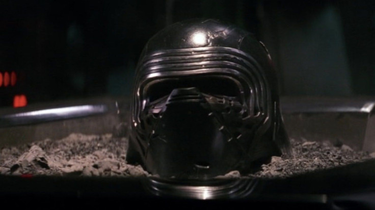 Kylo Ren's helmet resting in its bed of ash.
