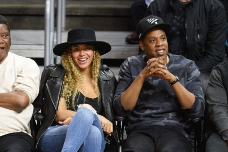 Beyonce (L) and Jay-Z attend a basketball game between the Oklahoma City Thunder and the Los Angeles Clippers at Staples Center on March 2, 2016 in Los Angeles, California.