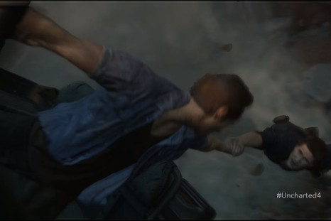 Nathan Drake is hanging on to Sam, who is hanging on to a wheel of a Jeep that is hanging off the edge of a cliff.