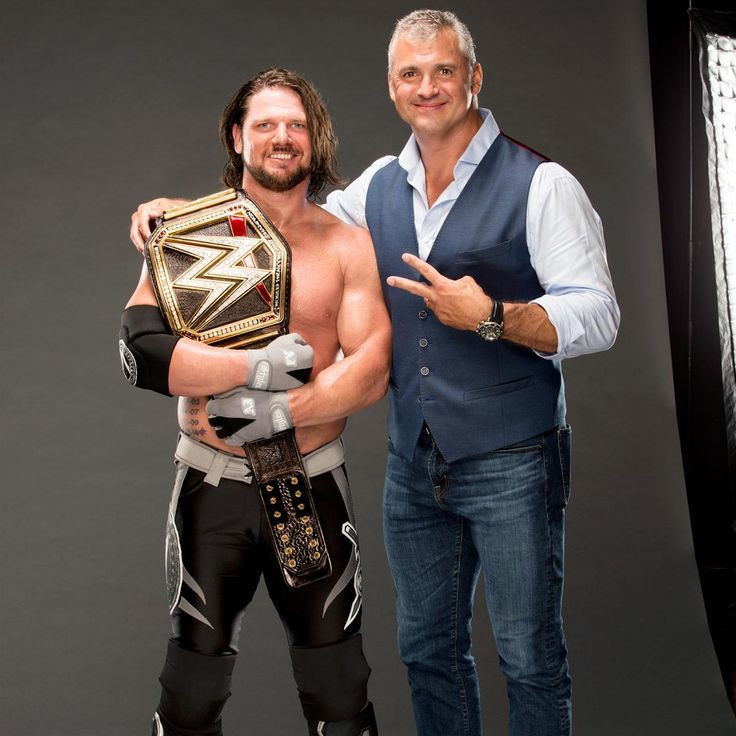 AJ Styles and Shane McMahon in happier times after Styles won the WWE Championship. 