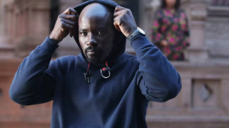 Luke Cage wears a simple navy-blue pullover hoodie.