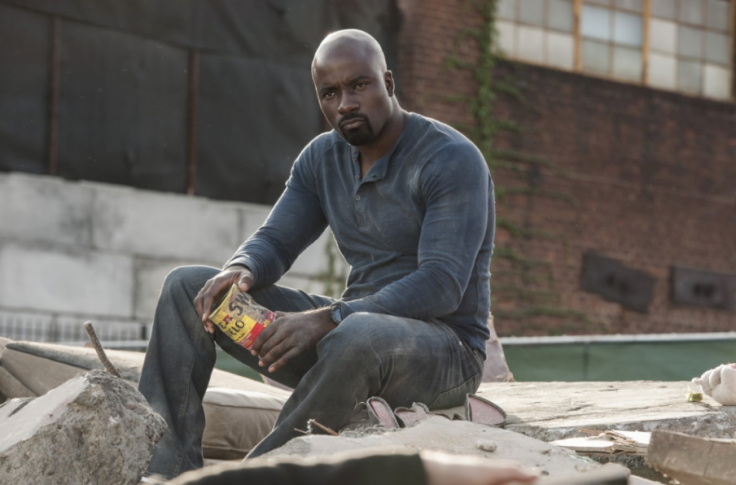 'Luke Cage' wears a worn-in Henley with distressed dark wash jeans.