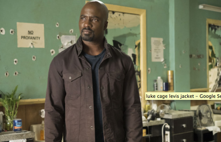 Luke Cage rocks a brown Levi's commuter trucker jacket with a blue t-shirt underneath.