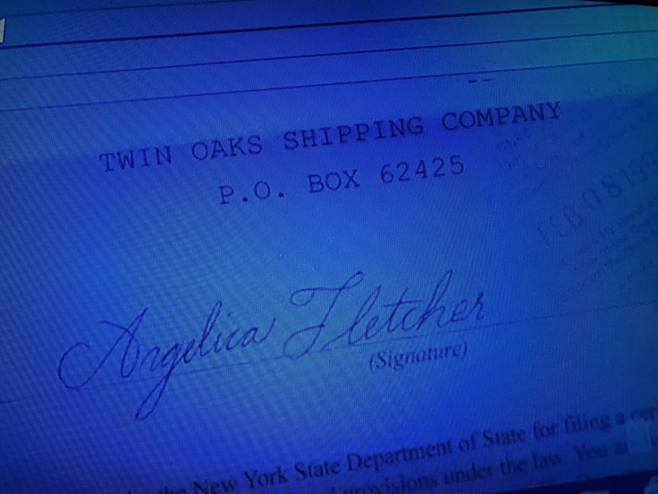 Jessica Jones looks up records on her computer. 