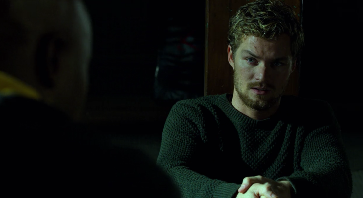 Iron Fist scoffs at Luke Cage. 