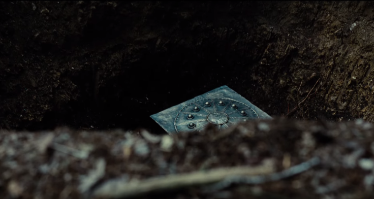 A Mother Box buried by who look to be New Gods in the Justice League trailer. 