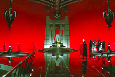 Admiral Hux stands before Snoke in the Supreme Leader's throne room.