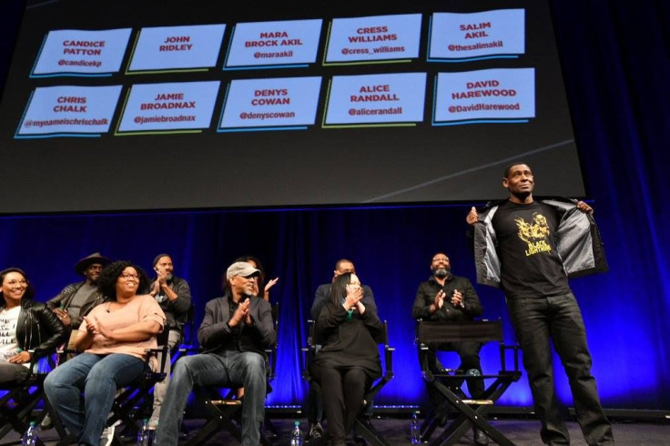 David Harewood shows off his Black Lightning shirt at DC In DC.