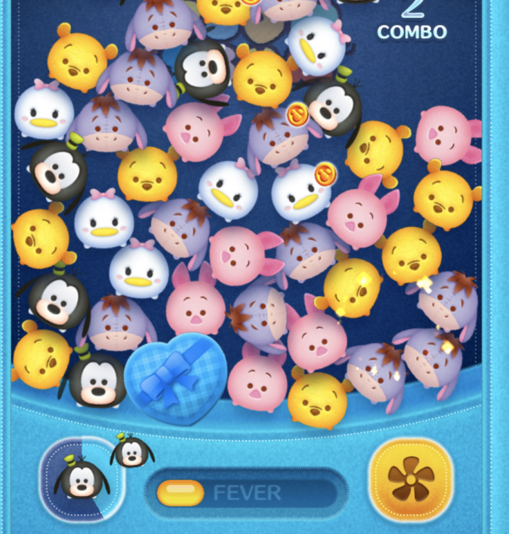 Making all capsules red in Disney Tsum Tsum's Sweetheart event requires poppin a bubble or using a skill next to blue, heart-shaped capsules.