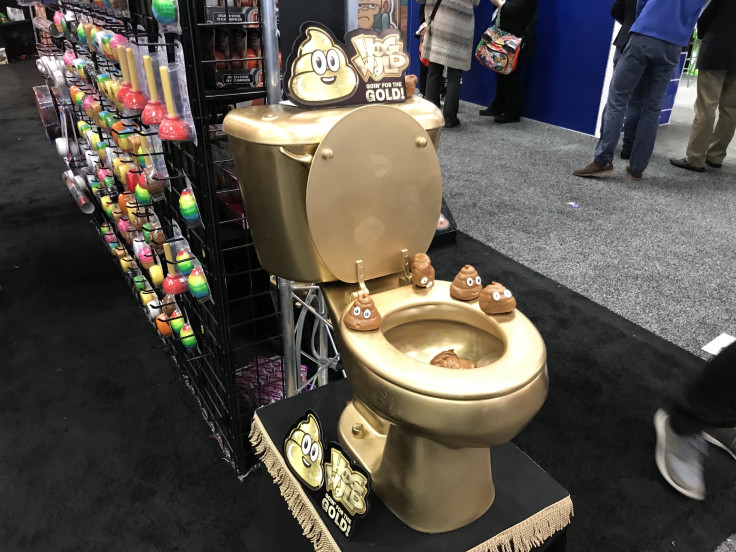 The golden toilet beckoning Toy Fair attendees over to the Hog Wild booth