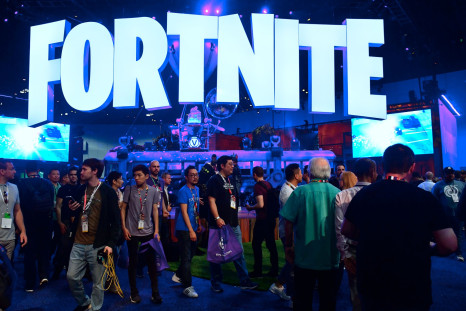 People crowd the display area for the survival game Fortnite at the 24th Electronic Expo, or E3 2018, in Los Angeles, California on on June 12, 2018, where hardware manufacturers, software developers and the video game industry present their new games.