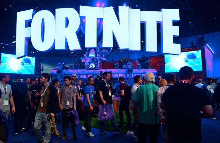 People crowd the display area for the survival game Fortnite at the 24th Electronic Expo, or E3 2018, in Los Angeles, California on on June 12, 2018, where hardware manufacturers, software developers and the video game industry present their new games.