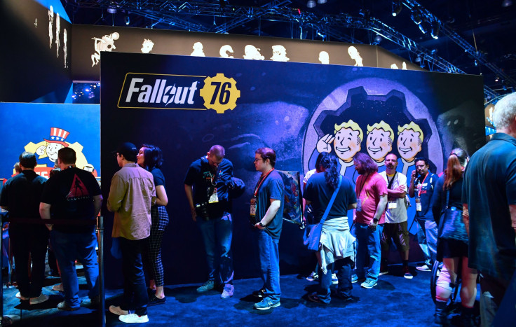 Gaming fans wait in line for freebies from Bethesda's 'Fallout 76' game at the 24th Electronic Expo, or E3 2018 in Los Angeles, California on June 13, 2018, where hardware manufacturers, software developers and the video game industry present their new ga