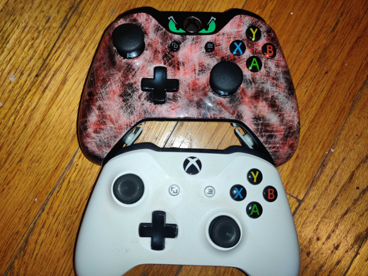 An Evil controller compared to a standard Xbox One controller