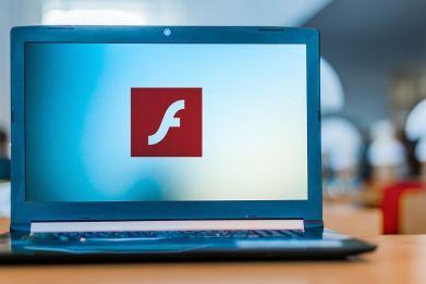 Laptop computer displaying logo of Adobe Flash.