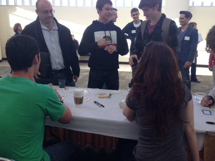 These folks arrived at JailbreakCon early for registration, but Justin had already come and gone! He was so excited to attend the event, he couldn't sleep for days! (Photo: Twitter)